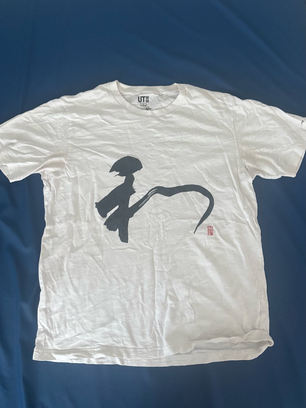 Uniqlo White Short-Sleeve Tee with Black Brushstroke Graphic